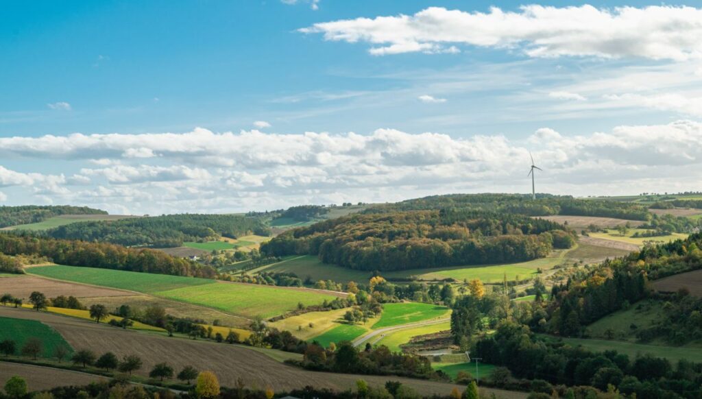 pexels photo 34448820 34448820 A panoramic view of rolling hills and wind turbines in autumn in Bad Mergentheim, Germany.